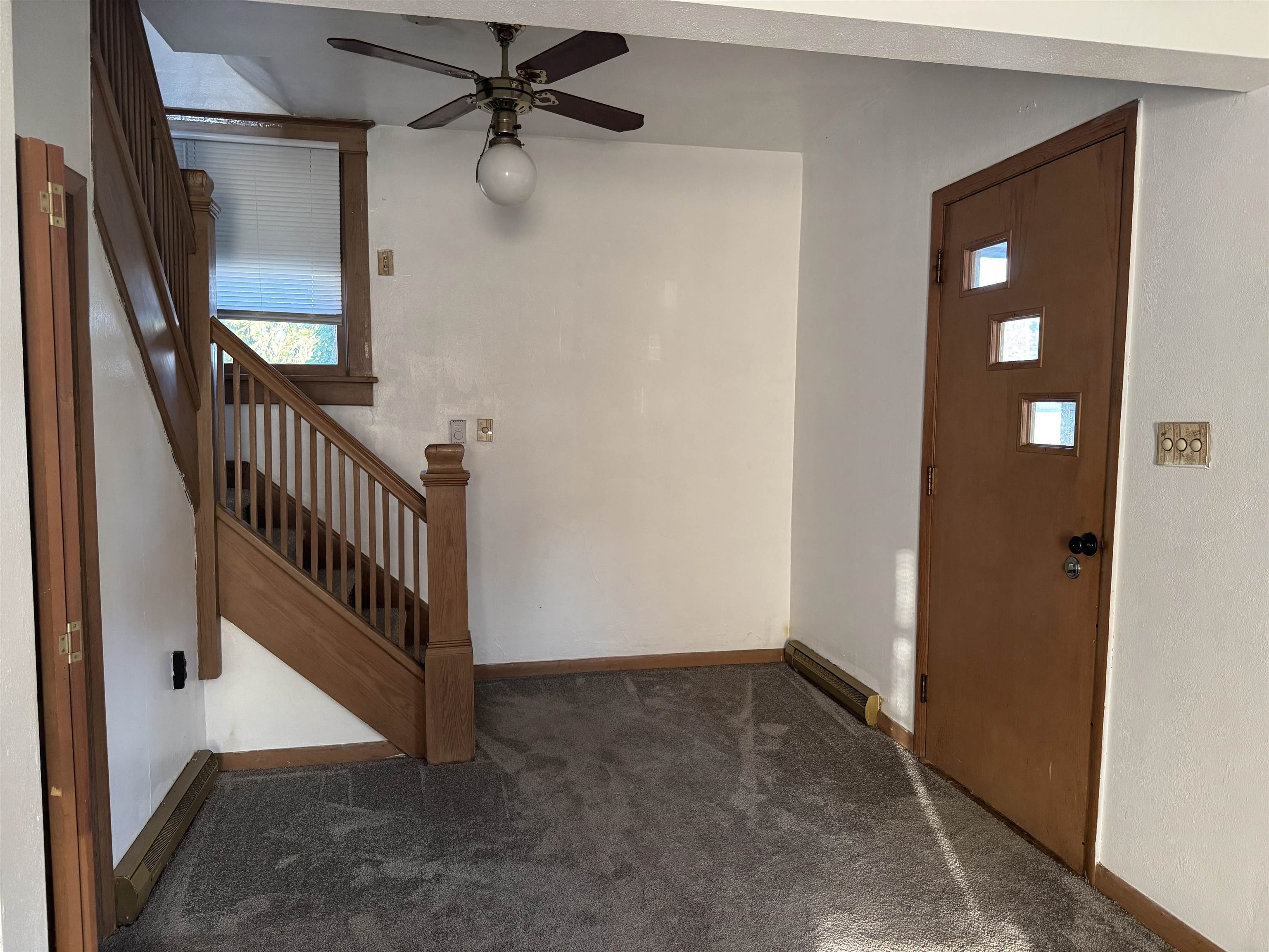 316 West American Street Freeport, IL 61032 - Photo 13 of 18 wooden floor in a hall with a window