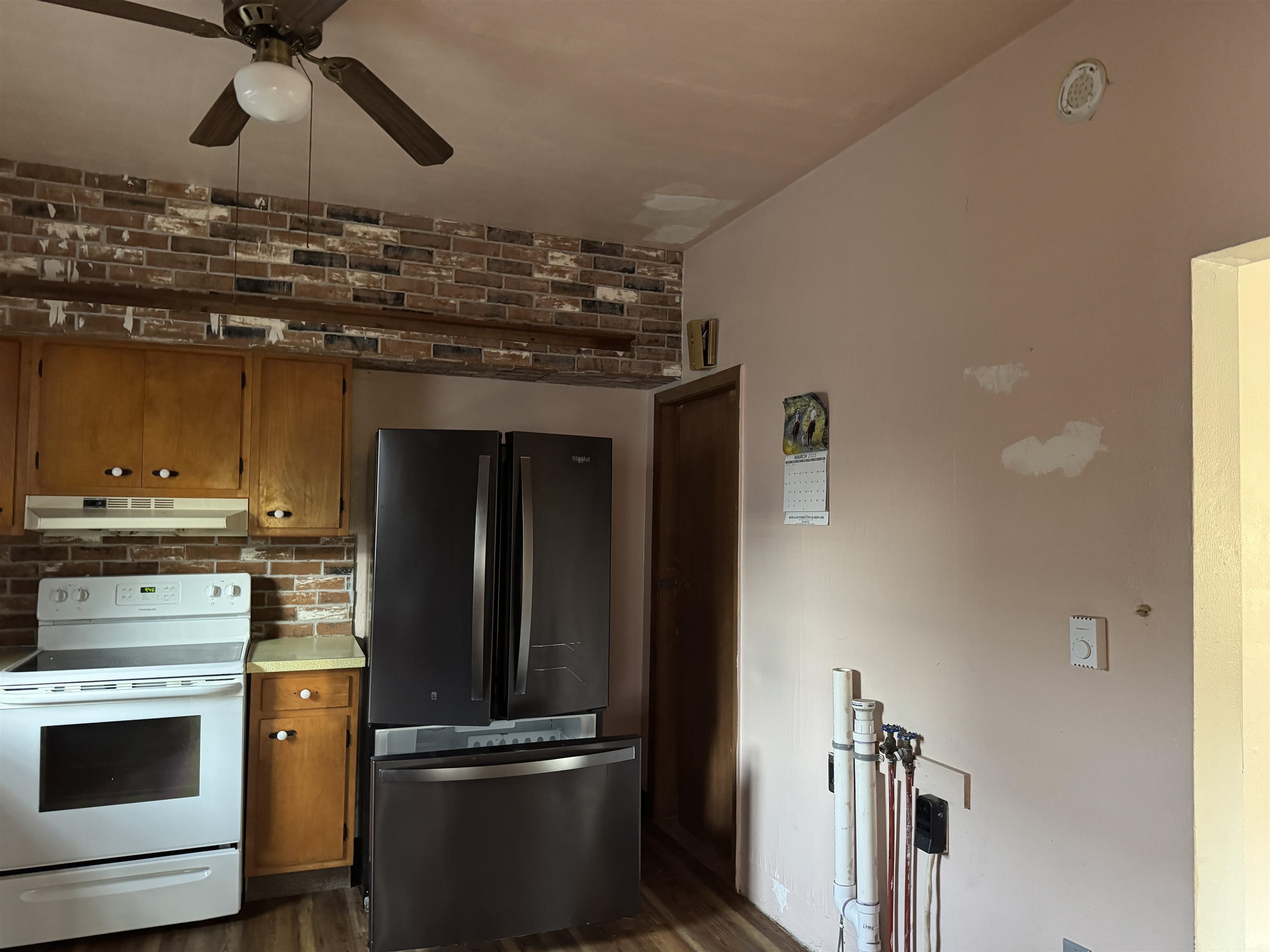 316 West American Street Freeport, IL 61032 - Photo 8 of 18 a kitchen with a refrigerator and stove