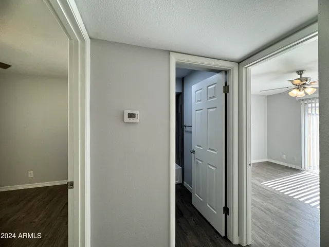 a view of a bathroom from a hallway