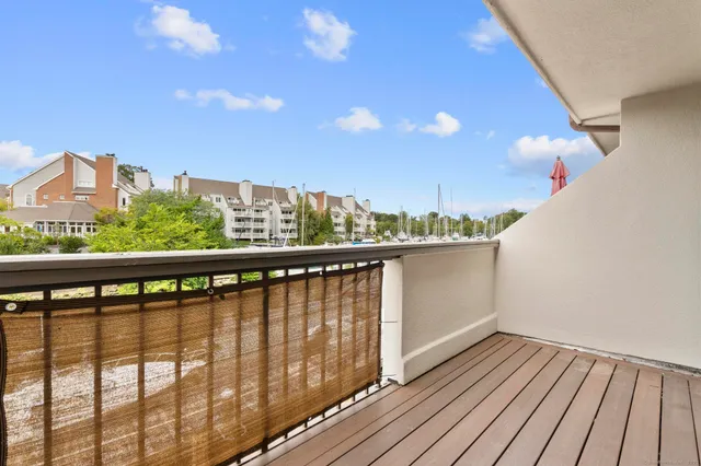 a view of a balcony with wooden floor