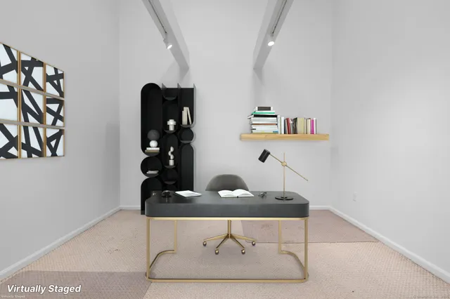 a room with a mirror and cabinets