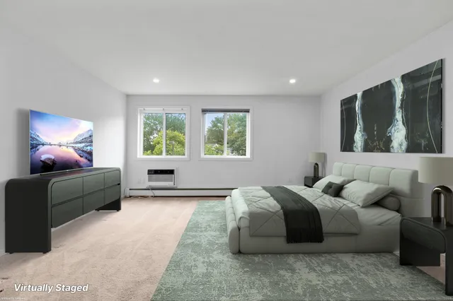 a bedroom with bed and a window