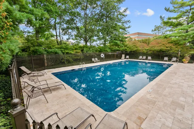 a view of a swimming pool with a patio