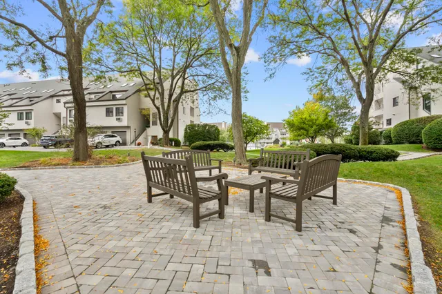 a view of a patio with a yard