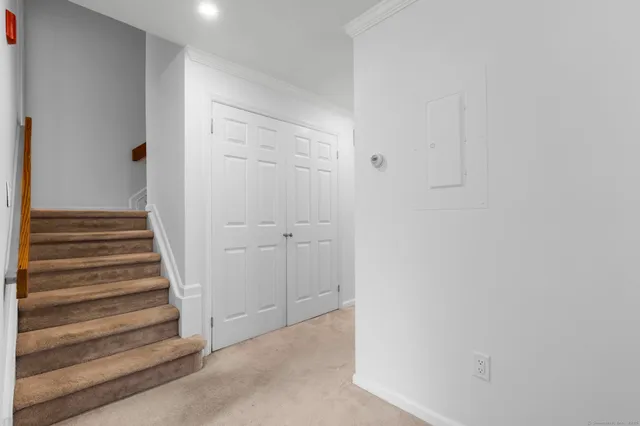 a view of a hallway with staircase