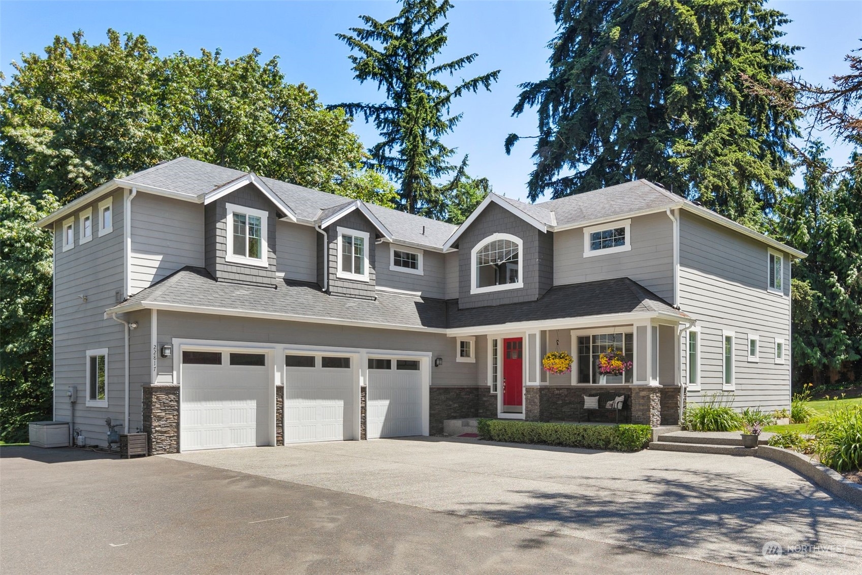 a front view of a house with a garden