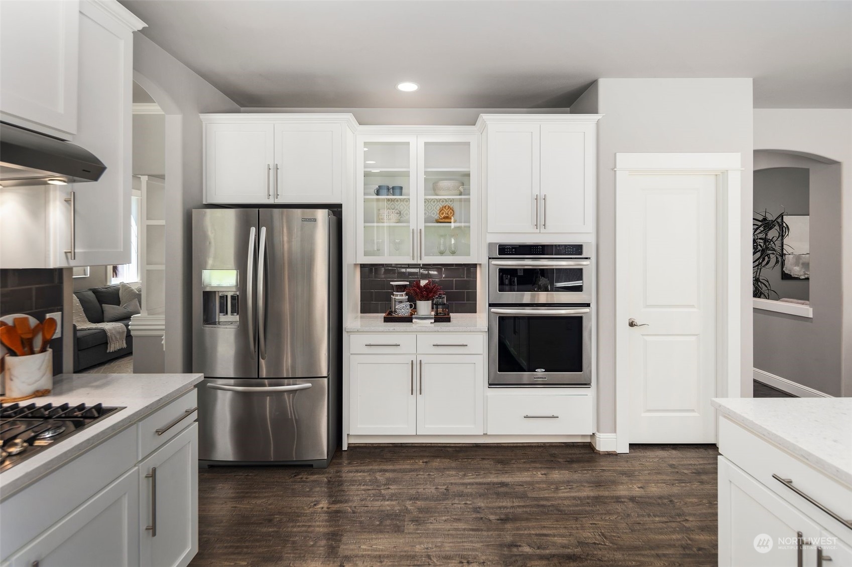 22817 Barker Road Bothell, WA 98021 - Photo 13 of 40 a kitchen with stainless steel appliances a refrigerator a stove and a sink