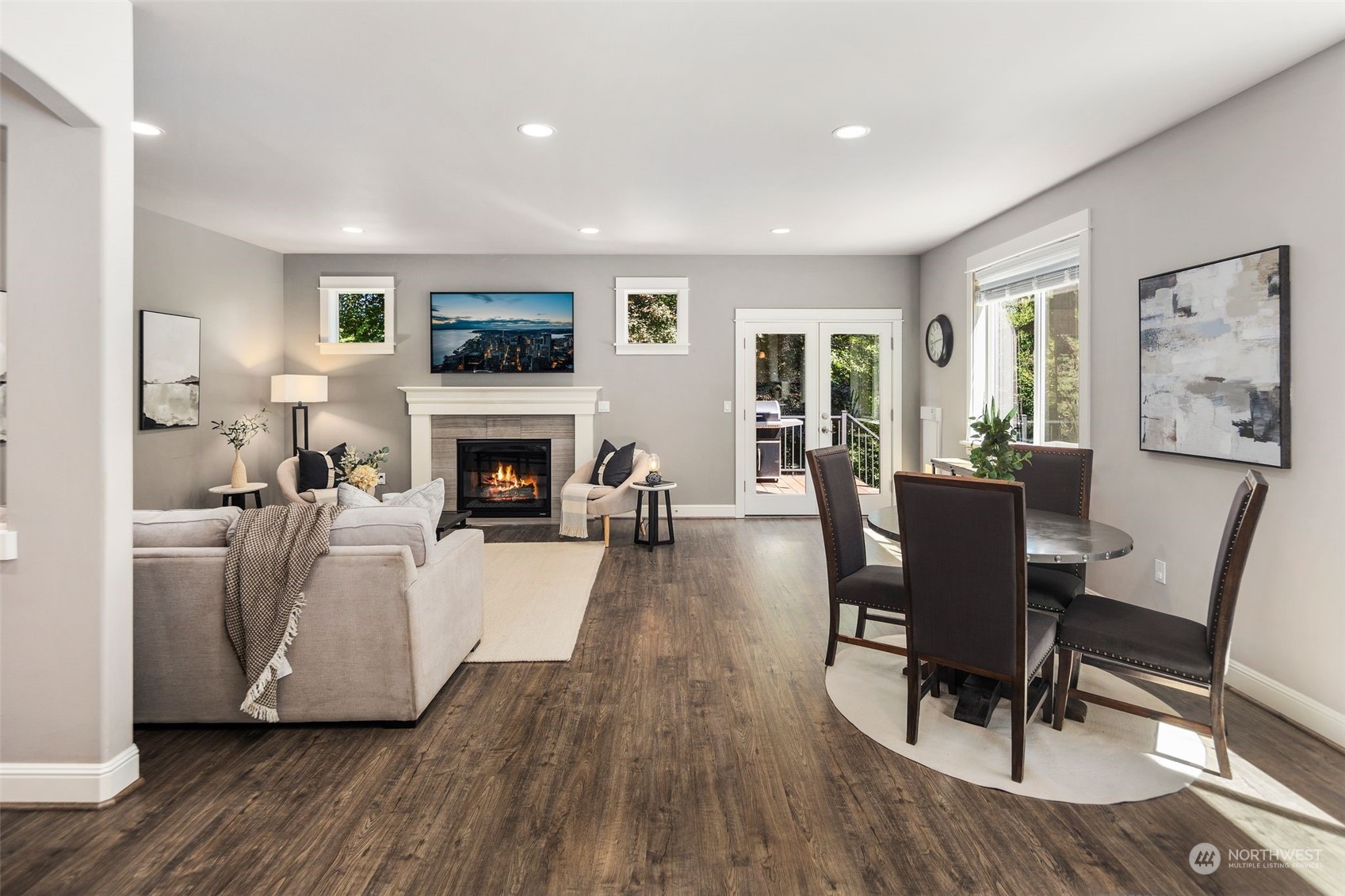 22817 Barker Road Bothell, WA 98021 - Photo 15 of 40 a living room with furniture a flat screen tv and a fireplace