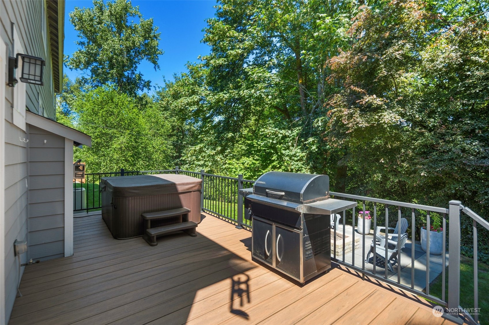 22817 Barker Road Bothell, WA 98021 - Photo 19 of 40 a view of a deck with two chairs and wooden fence