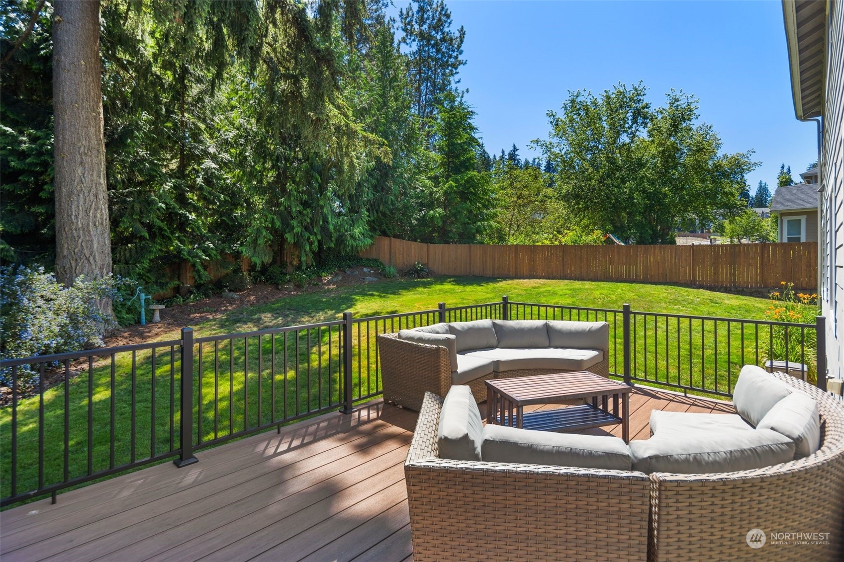 22817 Barker Road Bothell, WA 98021 - Photo 20 of 40 a view of a patio with couches chairs and a yard