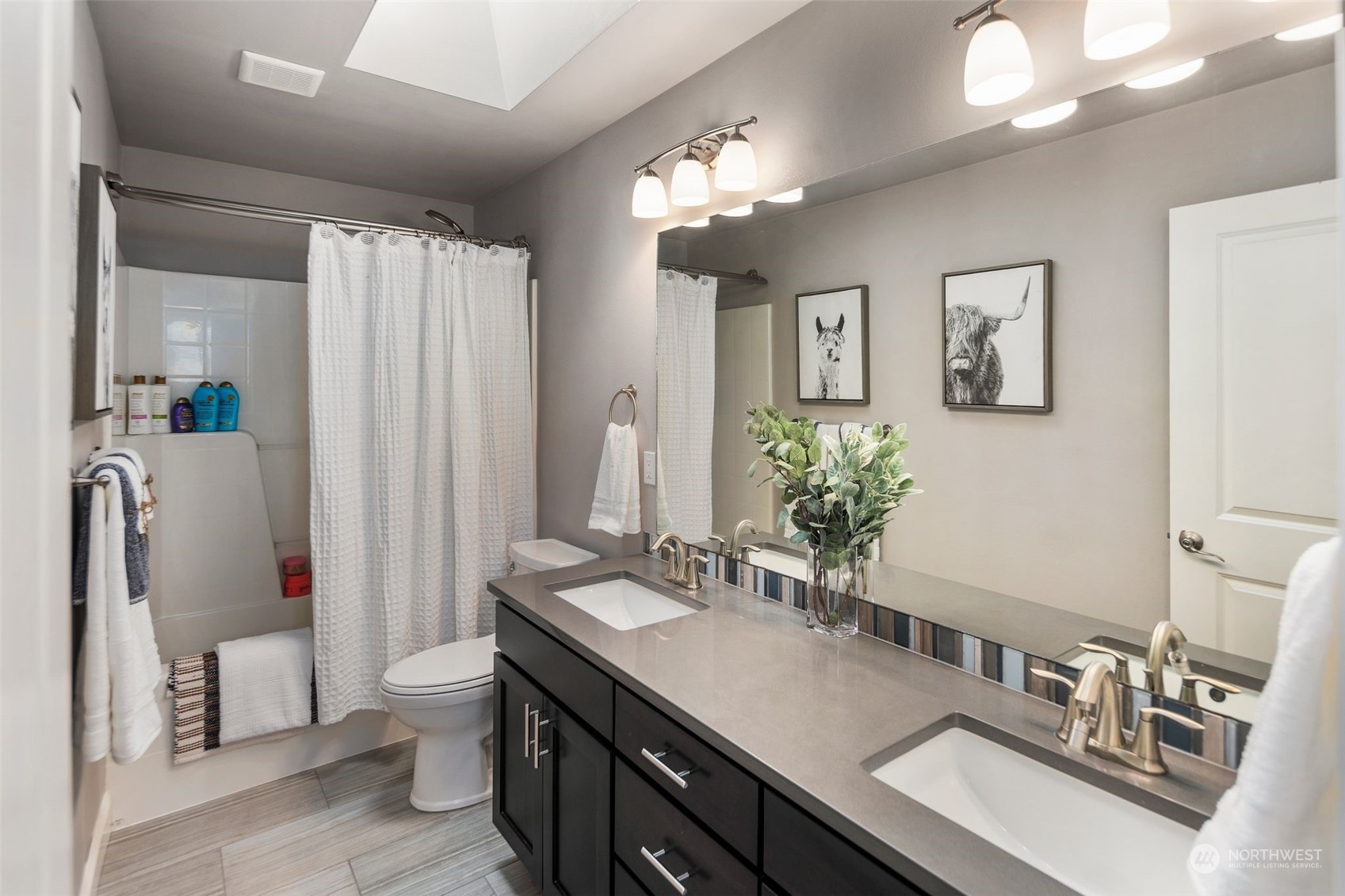 22817 Barker Road Bothell, WA 98021 - Photo 27 of 40 a bathroom with a granite countertop sink and a mirror