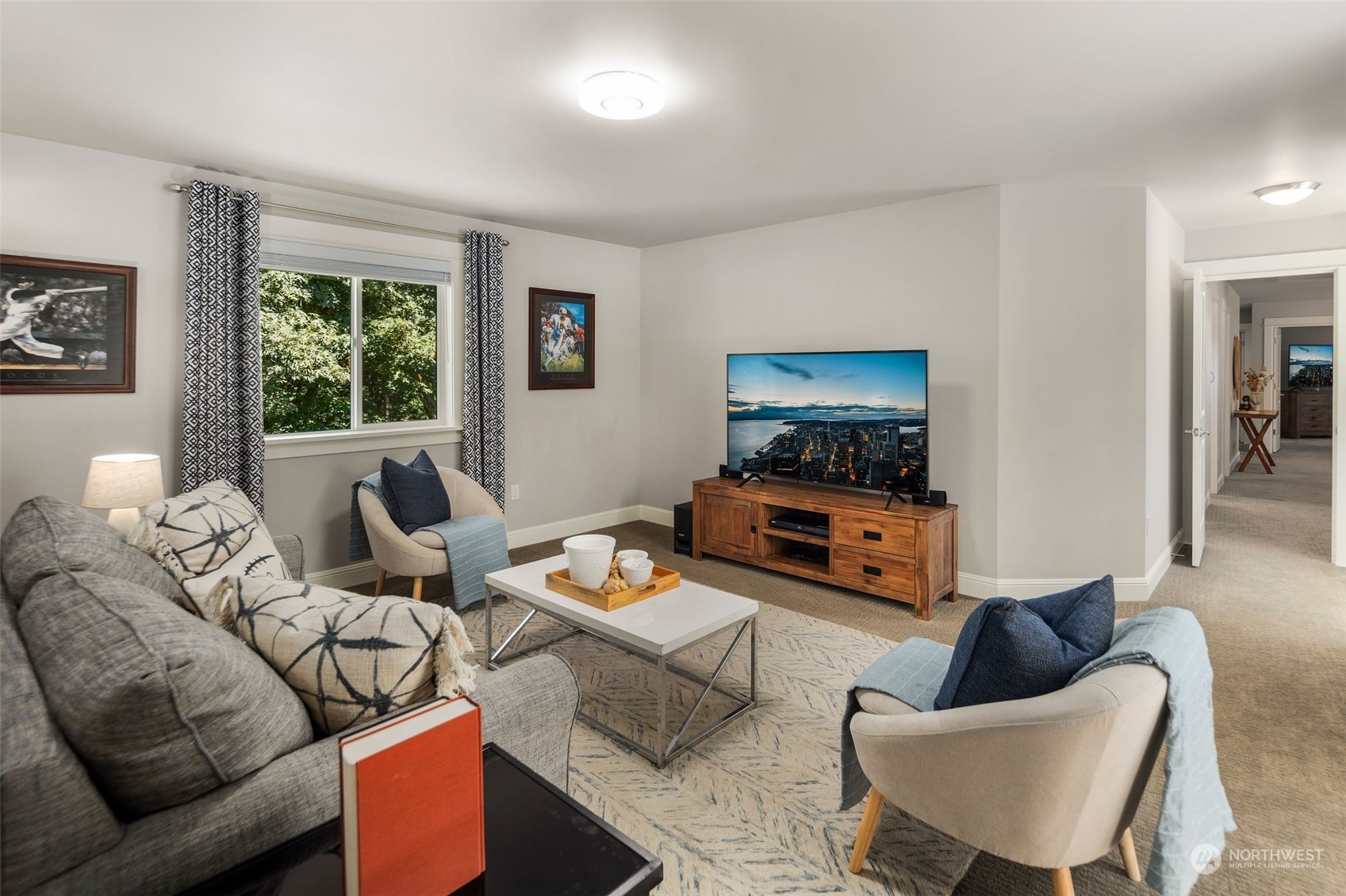 22817 Barker Road Bothell, WA 98021 - Photo 30 of 40 a living room with furniture and a flat screen tv