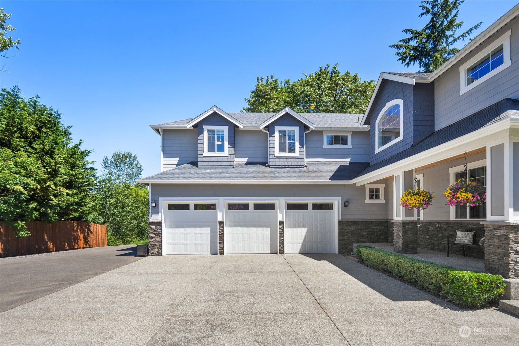 22817 Barker Road Bothell, WA 98021 - Photo 3 of 40 a front view of a house with a garden