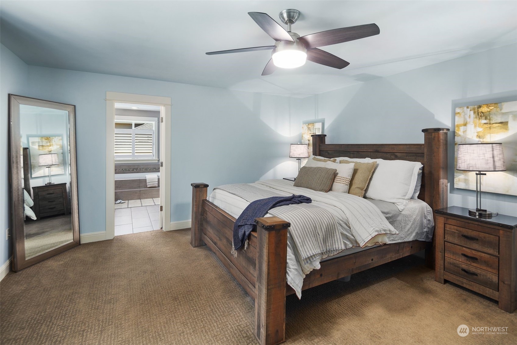 22817 Barker Road Bothell, WA 98021 - Photo 31 of 40 a bedroom with a bed and a ceiling fan