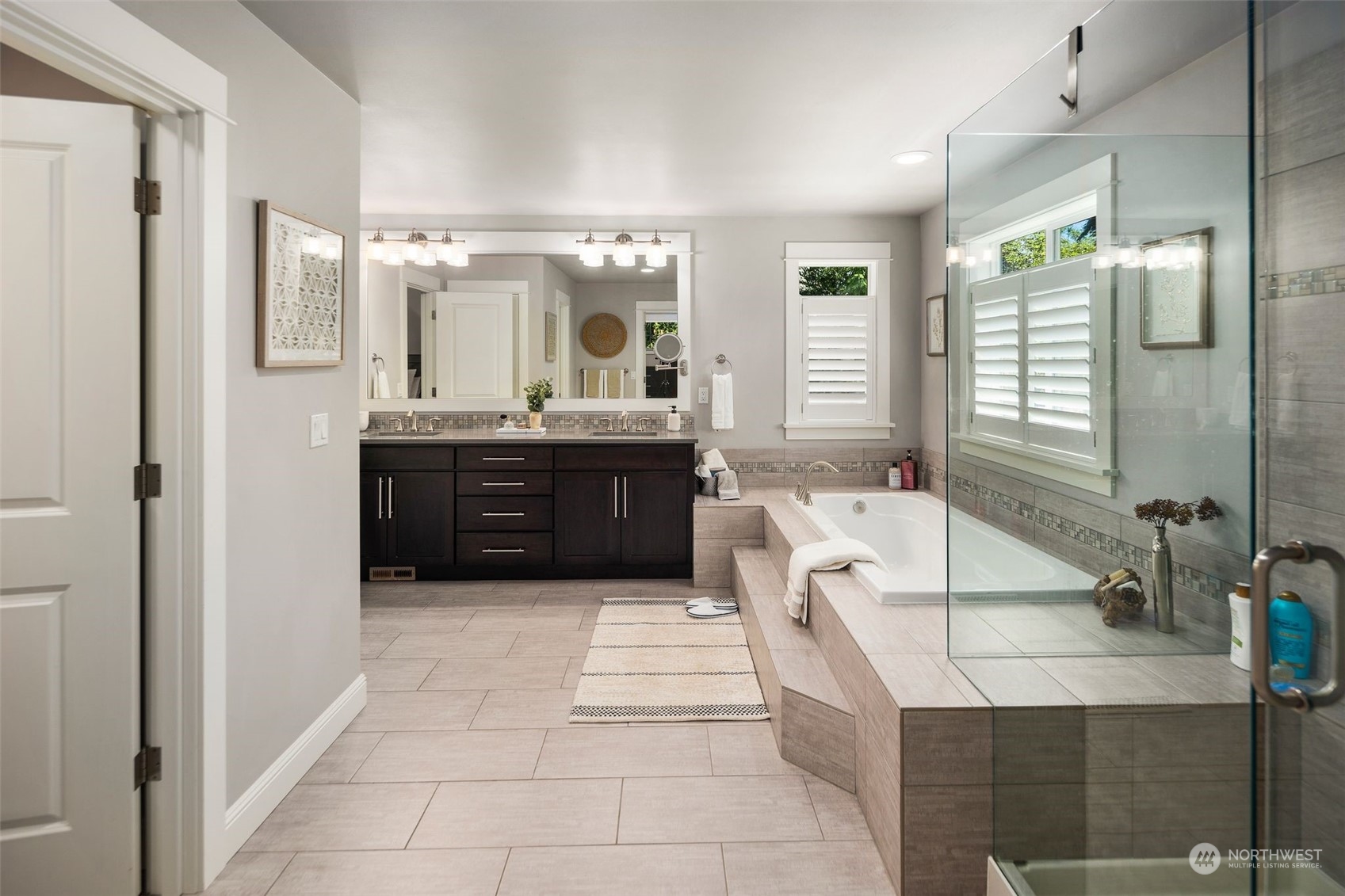 22817 Barker Road Bothell, WA 98021 - Photo 32 of 40 a bathroom with a tub sink and mirror