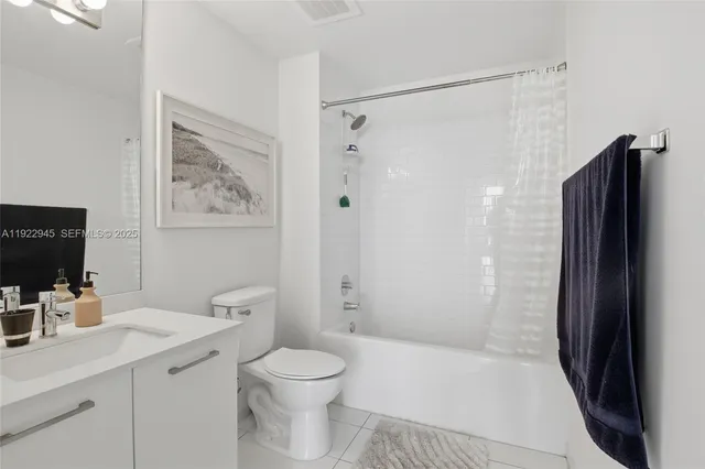 a bathroom with a shower toilet and sink