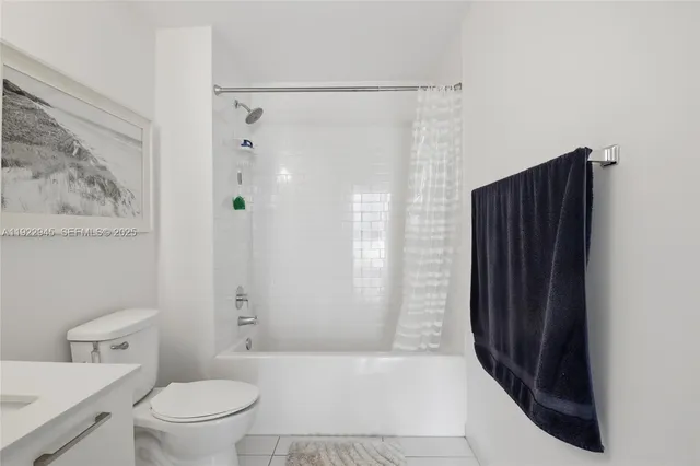 a bathroom with a shower and a toilet