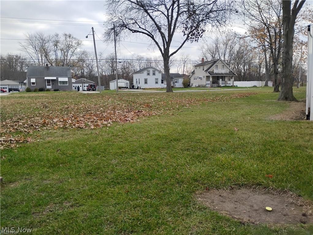 950 West River Road North Elyria, OH 44035 - Photo 10 of 13 From the back corner of the lot. Lot is staked with several pins, including this yellow one.