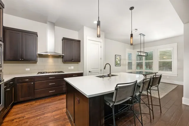 a view of a livingroom with furniture window and wooden floor