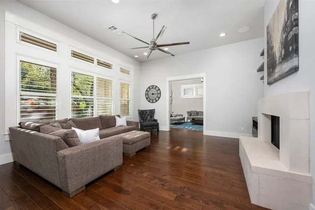 a view of a livingroom with wooden floor and a rug
