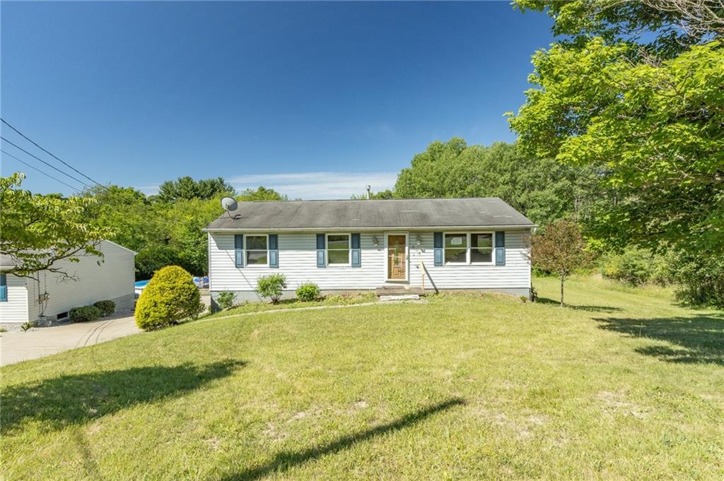 634 Bairdford Road Gibsonia, PA 15044 - Photo 2 of 23 a front view of a house with yard and green space