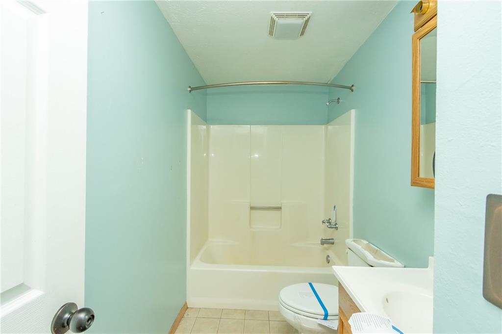 634 Bairdford Road Gibsonia, PA 15044 - Photo 21 of 23 a bathroom with a shower and a toilet