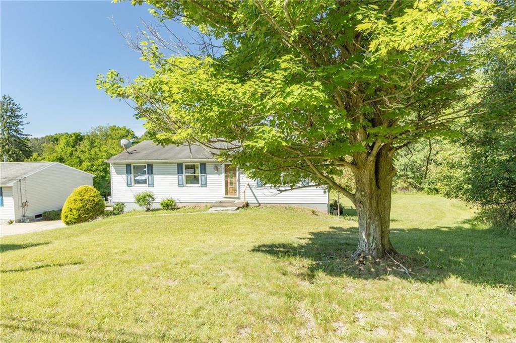 634 Bairdford Road Gibsonia, PA 15044 - Photo 3 of 23 a front view of a house with a yard