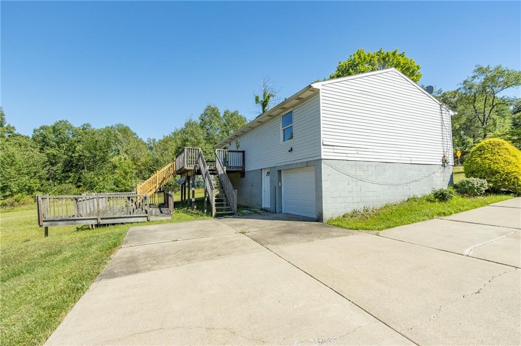 634 Bairdford Road Gibsonia, PA 15044 - Photo 4 of 23 a view of a house with a yard and a garage