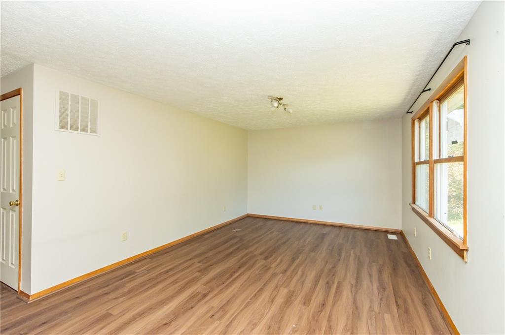 634 Bairdford Road Gibsonia, PA 15044 - Photo 7 of 23 a view of room with window and wooden floor