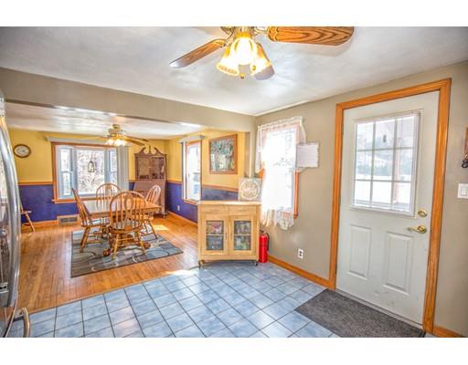 228 Old County Road Westfield, MA 01085 - Photo 3 of 23 a view of a livingroom with furniture cabinet and floor to ceiling window