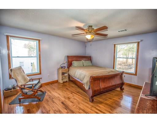 228 Old County Road Westfield, MA 01085 - Photo 10 of 23 a bedroom with a bed and a chair
