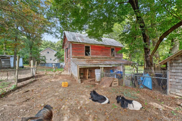 a view of a house with a tree
