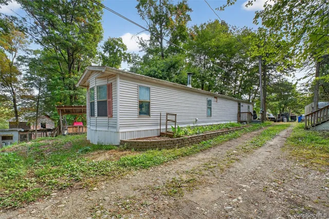 a backyard of a house with seating space