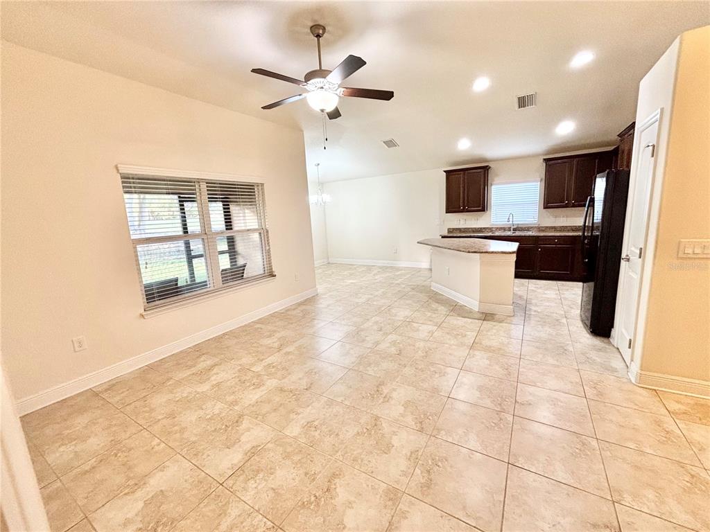 13231 Precept Way Hudson, FL 34669 - Photo 12 of 30 a view of a kitchen with kitchen appliances and a window