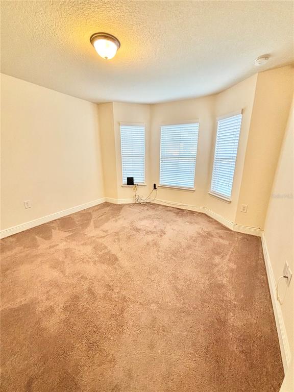 13231 Precept Way Hudson, FL 34669 - Photo 14 of 30 a view of an empty room with a window