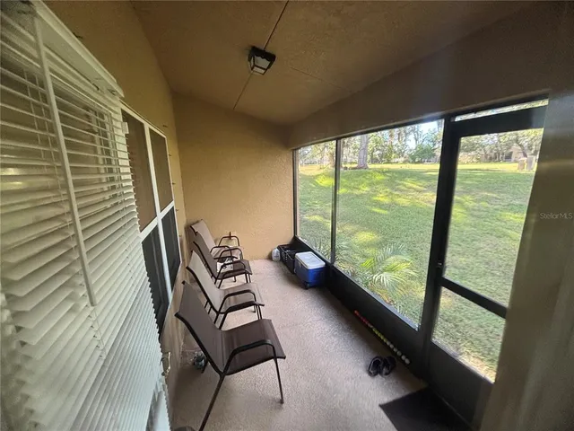 a view of a swimming pool and a yard