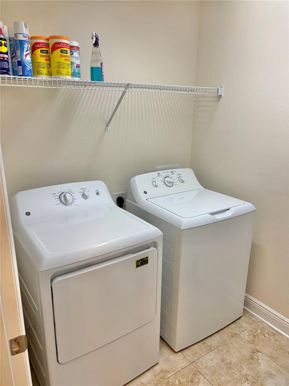13231 Precept Way Hudson, FL 34669 - Photo 17 of 30 a utility room with dryer and washer