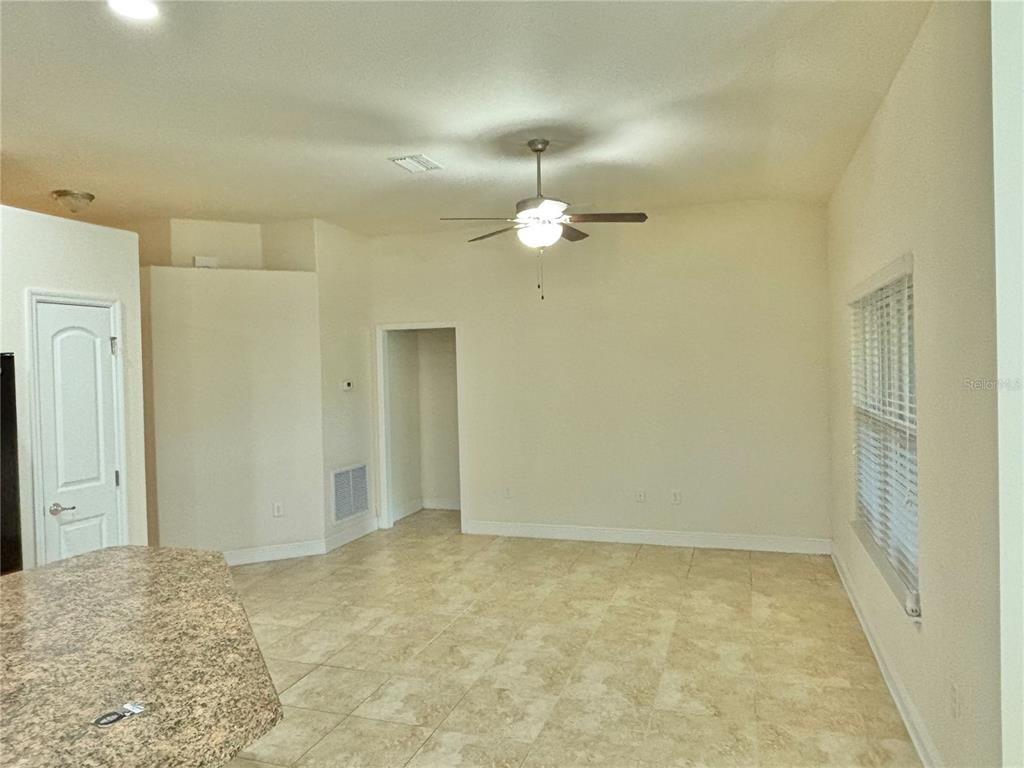 13231 Precept Way Hudson, FL 34669 - Photo 19 of 30 an empty room with a bathroom