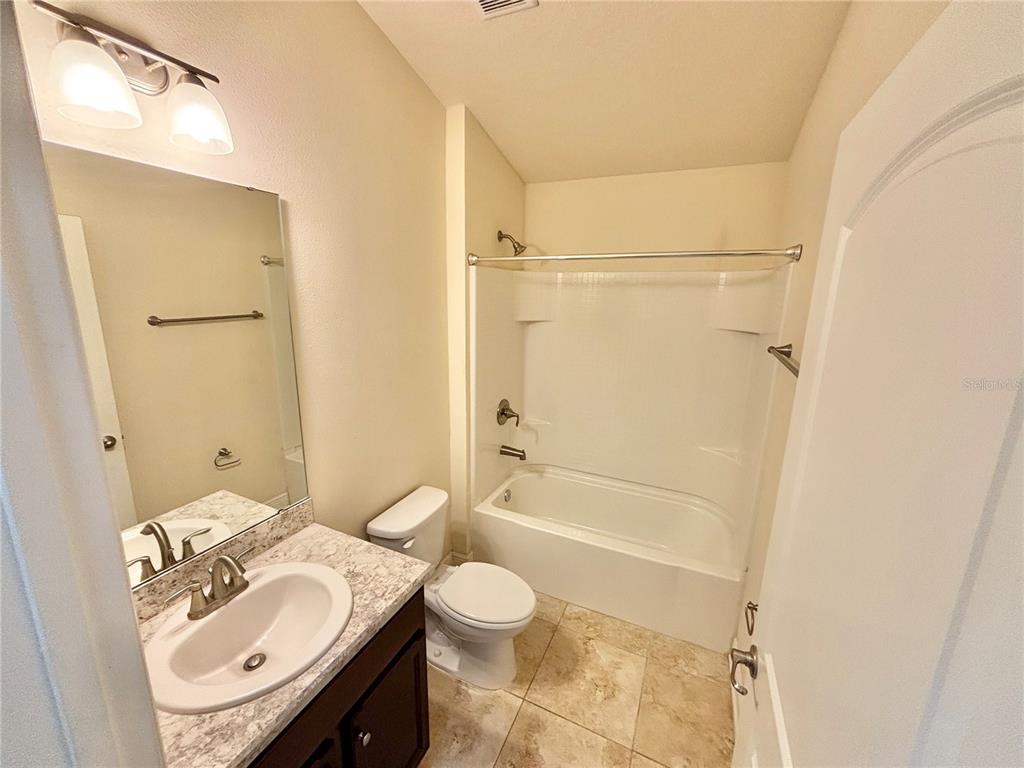 13231 Precept Way Hudson, FL 34669 - Photo 20 of 30 a bathroom with a sink toilet and shower