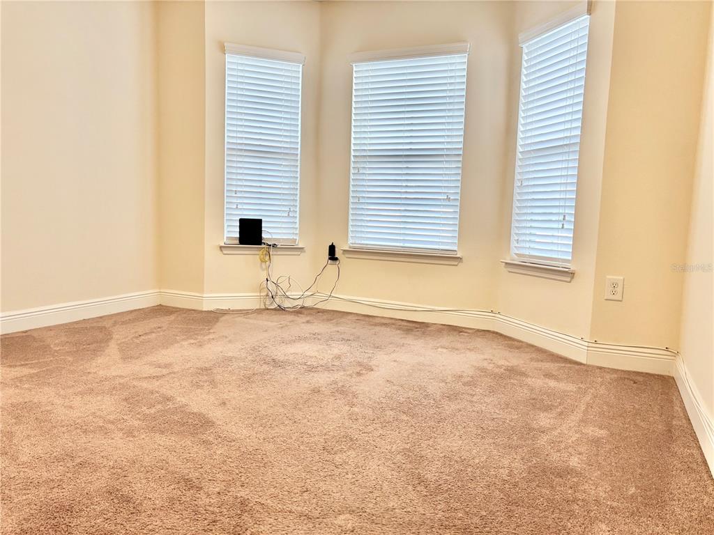 13231 Precept Way Hudson, FL 34669 - Photo 2 of 30 an empty room with a window