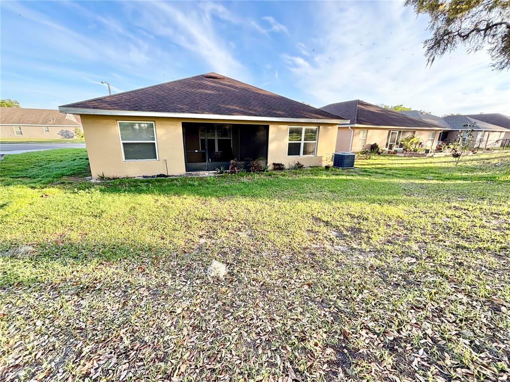 13231 Precept Way Hudson, FL 34669 - Photo 29 of 30 a front view of a house with garden