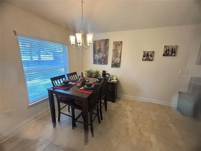 a view of a dining room with furniture