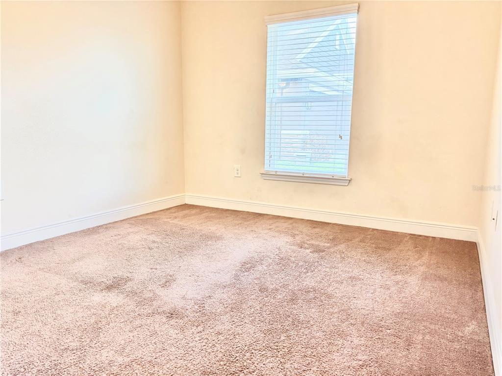 13231 Precept Way Hudson, FL 34669 - Photo 3 of 30 an empty room with windows