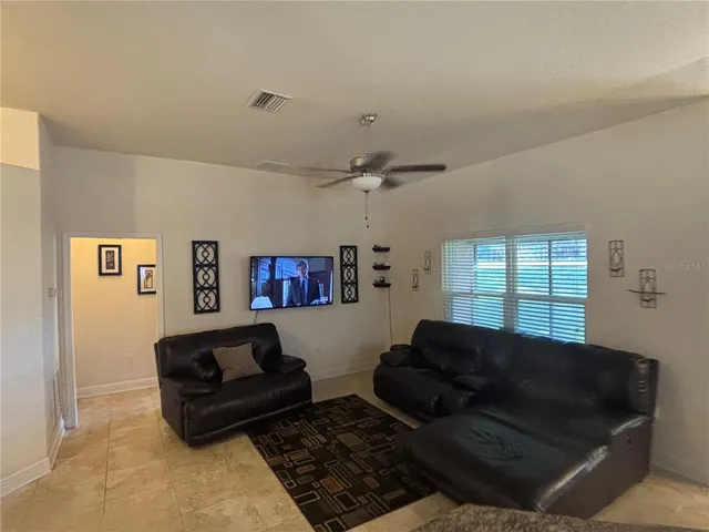 a living room with furniture and a rug