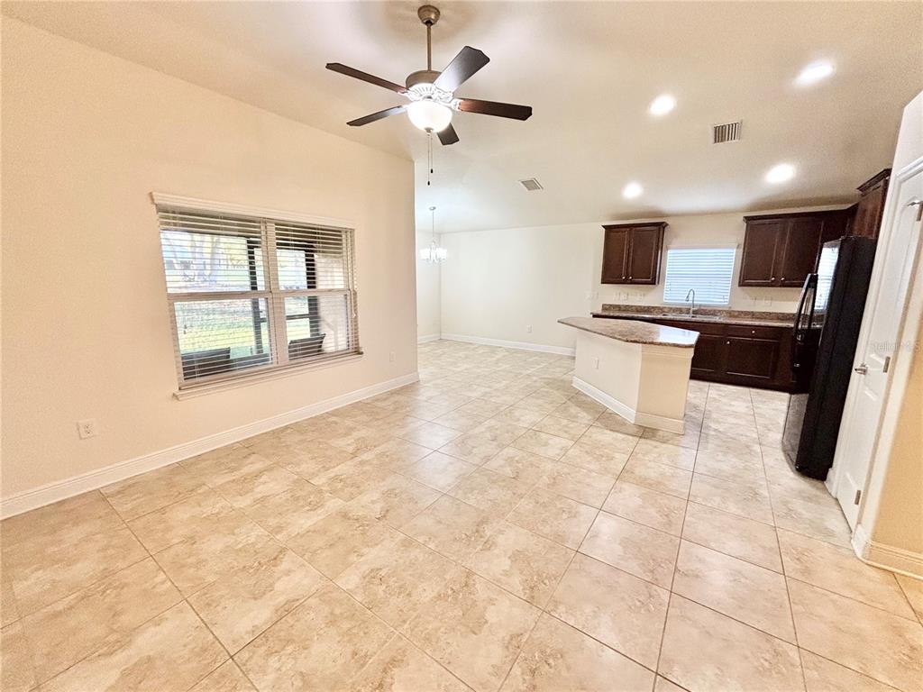 13231 Precept Way Hudson, FL 34669 - Photo 5 of 30 a view of kitchen with sink microwave and refrigerator