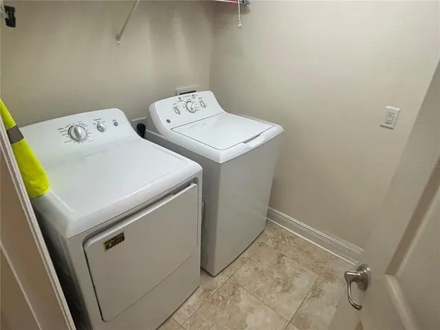 a utility room with dryer and washer