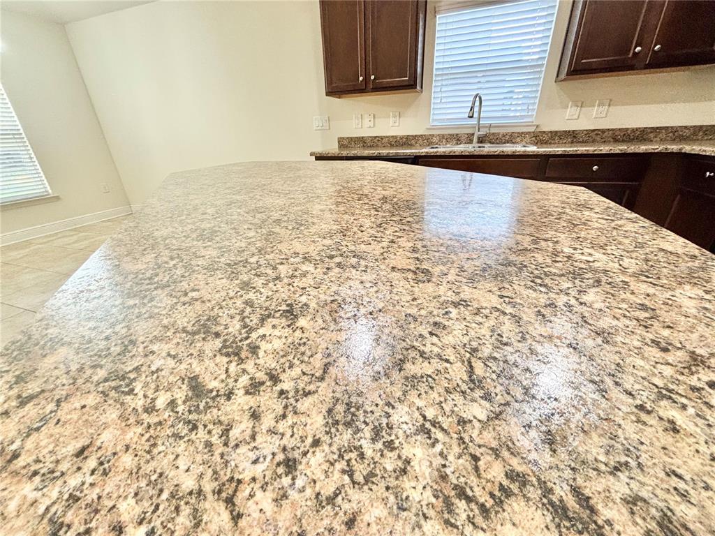 13231 Precept Way Hudson, FL 34669 - Photo 7 of 30 a view of a kitchen from an empty room
