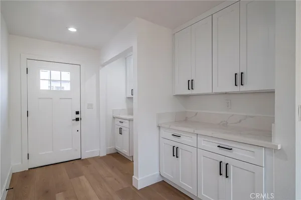 a view of cabinets and wooden floor