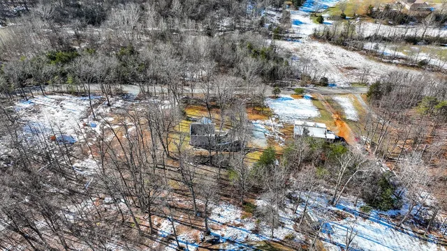 a view of entryway with wooden floor and stairs