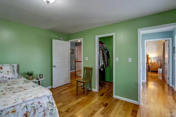 a bedroom with a bed and a table in it